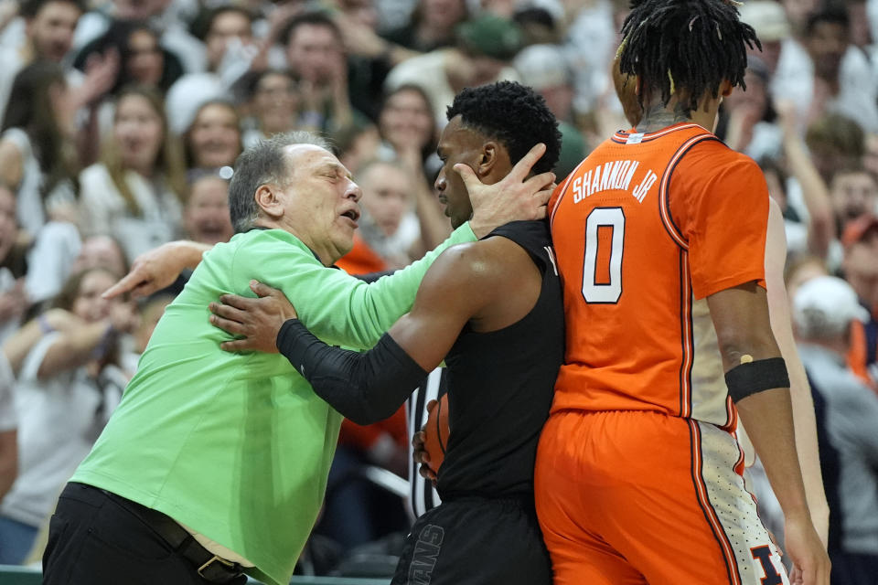 Michigan State head coach Tom Izzo hugs guard Tyson Walker during the second half of an NCAA college basketball game against Illinois, Saturday, Feb. 10, 2024, in East Lansing, Mich. (AP Photo/Carlos Osorio)