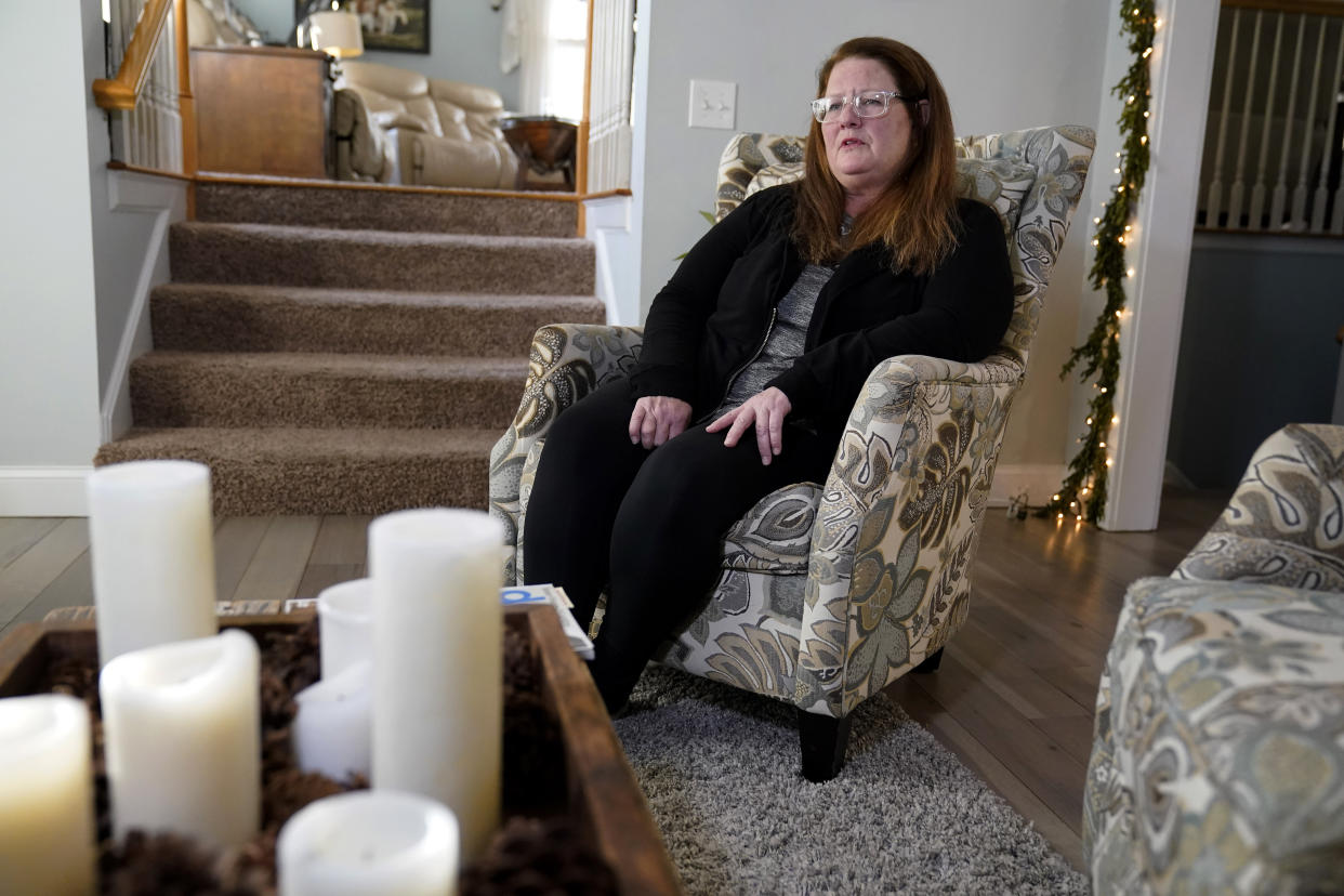 Tracey Ferguson, mother of D.J. Ferguson, speaks with an Associated Press reporter Wednesday, Jan. 26, 2022, during an interview at her home, in Mendon, Mass. A Boston hospital is defending itself after Ferguson's family claimed D.J. was denied a new heart for refusing to be vaccinated against COVID-19, saying most transplant programs around the country set similar requirements to improve patients' chances of survival. (AP Photo/Steven Senne)