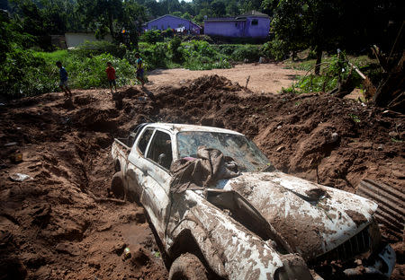A wreckage of a vehicle remains after a body was recovered from under the mud after heavy rains caused by flooding in Marianhill near Durban, South Africa, April 25, 2019. REUTERS/Rogan Ward