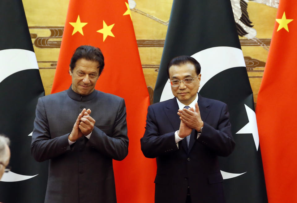 Pakistani Prime Minister Imran Khan, left, and China's Premier Li Keqiang attend a signing ceremony at the Great Hall of the People in Beijing Saturday, Nov. 3, 2018. (Jason Lee/Pool Photo via AP)