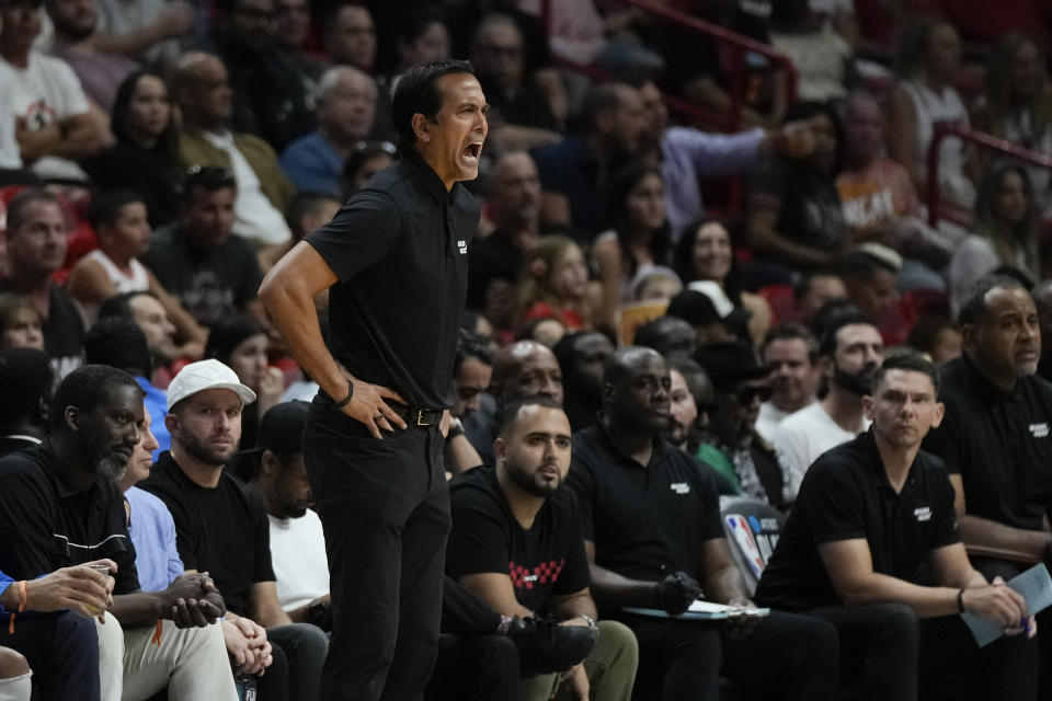 Miami Heat head coach Erik Spoelstra, front, shouts to his players during the first half of an NBA basketball play-in tournament game against the Chicago Bulls, Friday, April 14, 2023, in Miami. (AP Photo/Rebecca Blackwell)