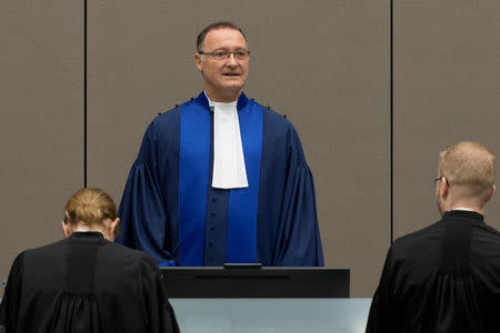 Presiding judge Bertram Schmitt of Germany opens the trial of Dominic Ongwen, a senior commander in the Lord's Resistance Army, whose fugitive leader Kony is one of the world's most-wanted war crimes suspects, at the International Court in The Hague, Netherlands, December 6, 2016. REUTERS/Peter Dejong/Pool