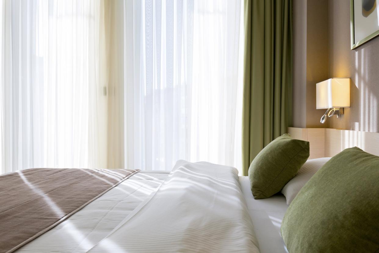 interior of a hotel bedroom in the morning