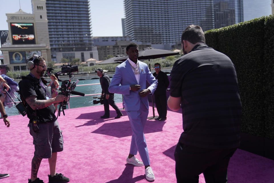 Cincinnati cornerback Ahmad Gardner walks to the red carpet before the first round of the NFL football draft Thursday, April 28, 2022, in Las Vegas. (AP Photo/Jae C. Hong)