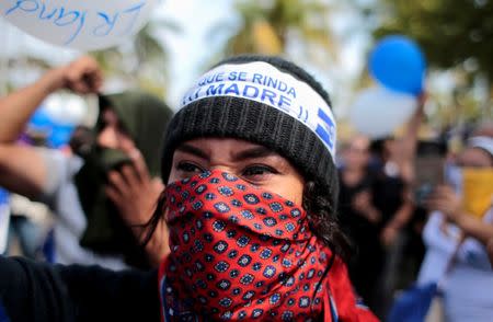 FILE PHOTO: A masked demonstrator takes part in a protest against Nicaraguan President Daniel Ortega's government at the Metropolitan Cathedral in Managua, Nicaragua May 17,2019.REUTERS/Oswaldo Rivas/File Photo