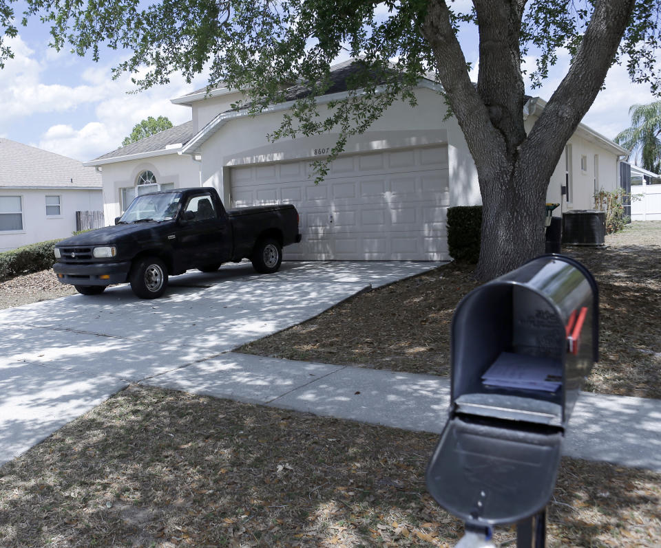 The home of Gustavo 'Taby' Flacon sits vacant in a quiet suburb in Kissimmee, Fla., on Thursday, April 13, 2017, the day after his arrest for drug smuggling. Falcon was arrested and charged with smuggling tons of cocaine into the United States in the 1980's. (AP Photo/John Raoux)