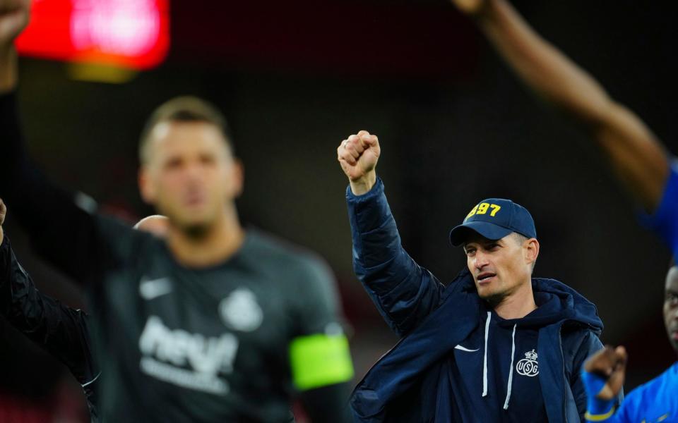 Union Saint-Gilloise manager Alexander Blessin salutes supporters after a Europa League Group E soccer match