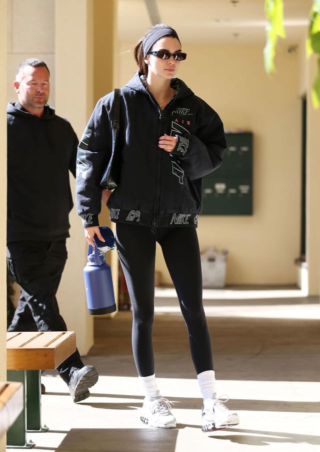 Kendall Jenner sports a hoodie and leggings as she braves the rain