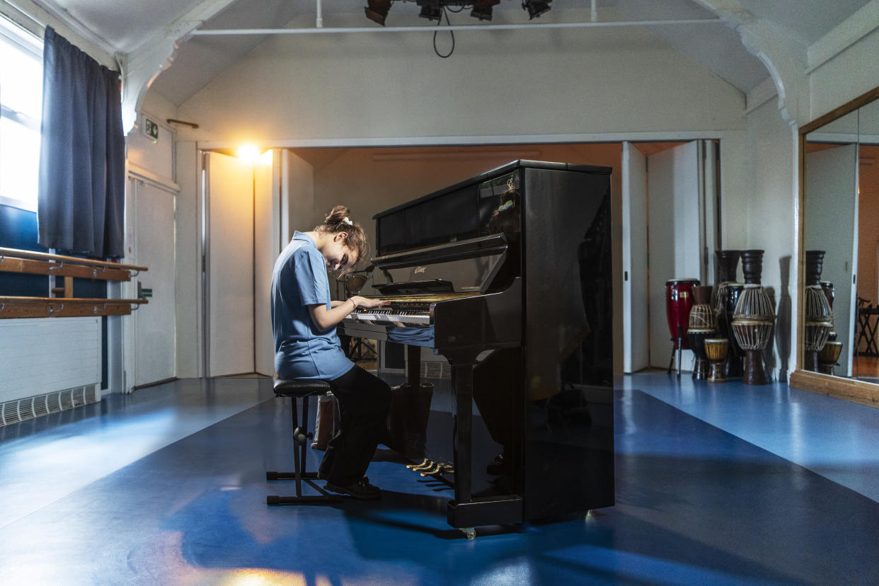 Lucy plays the piano