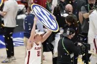 Alabama's Britton Johnson celebrates after beating LSU in the championship game of the NCAA college basketball Southeastern Conference Tournament Sunday, March 14, 2021, in Nashville, Tenn. Alabama won 80-79. (AP Photo/Mark Humphrey)