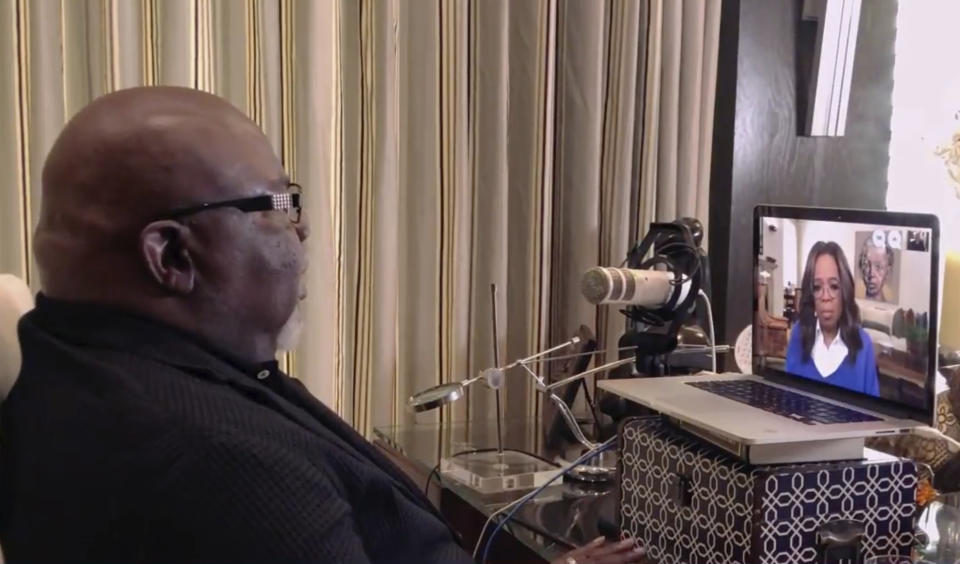 In a photo provided by The Call to Unite, bishop T.J. Jakes, left, speaks to Oprah Winfrey, seen on screen, during a 24-hour live, which was transmitted Friday, May 1, 2020. (The Call to Unite via AP)