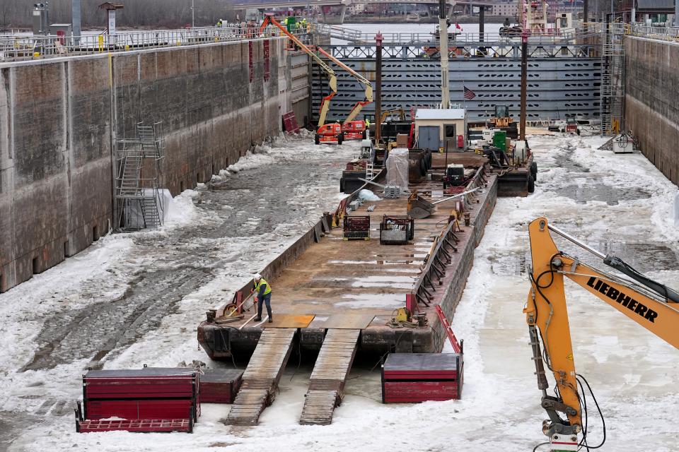 A barge sits on the bottom of the chamber at Lock and Dam No. 2 on Jan. 30. The barge was used to float in heavy equipment to make repairs to the chamber, which was put into service in 1948.