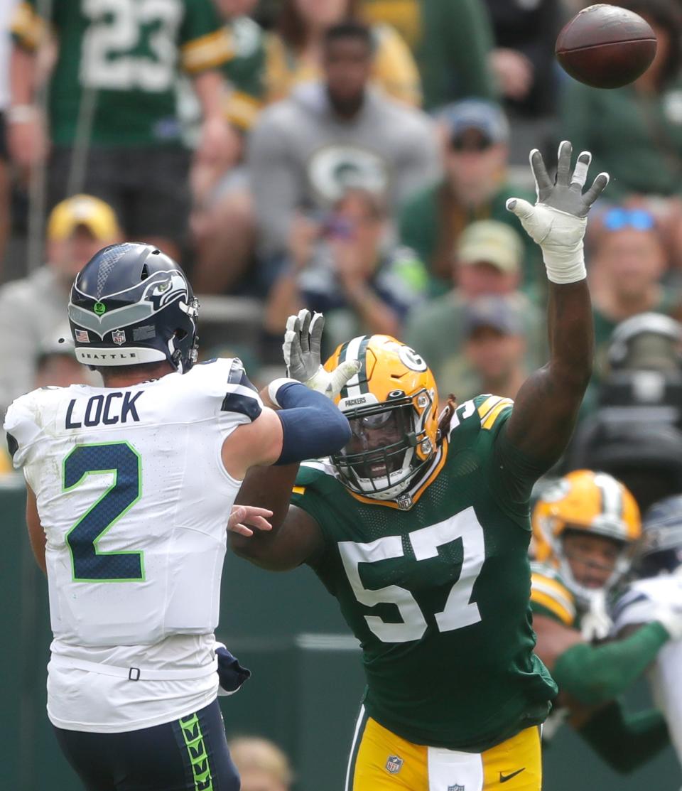 Green Bay Packers linebacker Brenton Cox Jr. (57) rushes <a class="link " href="https://sports.yahoo.com/nfl/teams/seattle/" data-i13n="sec:content-canvas;subsec:anchor_text;elm:context_link" data-ylk="slk:Seattle Seahawks;sec:content-canvas;subsec:anchor_text;elm:context_link;itc:0">Seattle Seahawks</a> quarterback <a class="link " href="https://sports.yahoo.com/nfl/players/31874" data-i13n="sec:content-canvas;subsec:anchor_text;elm:context_link" data-ylk="slk:Drew Lock;sec:content-canvas;subsec:anchor_text;elm:context_link;itc:0">Drew Lock</a> (2) during their preseason football game Saturday, August 26, 2023, at Lambeau Field in Green Bay, Wis. Green Bay defeated Seattle 19-15. Wm. Glasheen USA TODAY NETWORK-Wisconsin