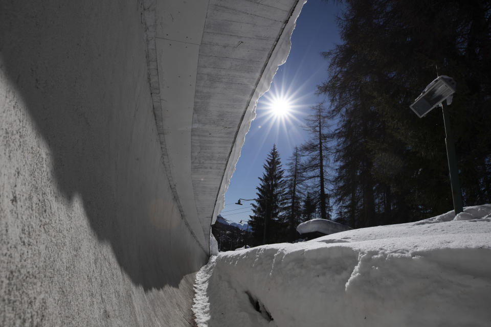 A view of the bobsled track in Cortina d'Ampezzo, Italy, Wednesday, Feb. 17, 2021. Bobsledding tradition in Cortina goes back nearly a century and locals are hoping that the Eugenio Monti track can be reopened for the 2026 Olympics in the Italian resort. (AP Photo/Gabriele Facciotti)