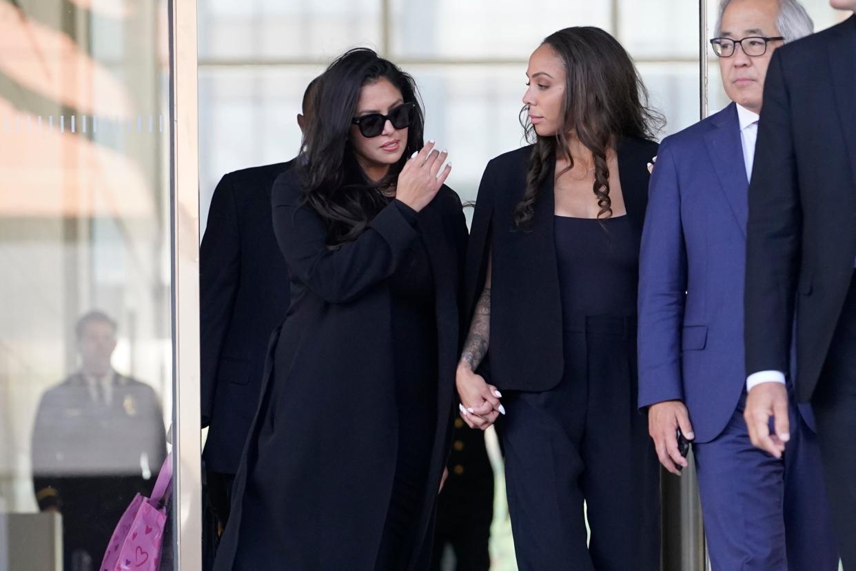 Vanessa Bryant, left, widow of Kobe Bryant, leaves the federal courthouse Friday in Los Angeles.