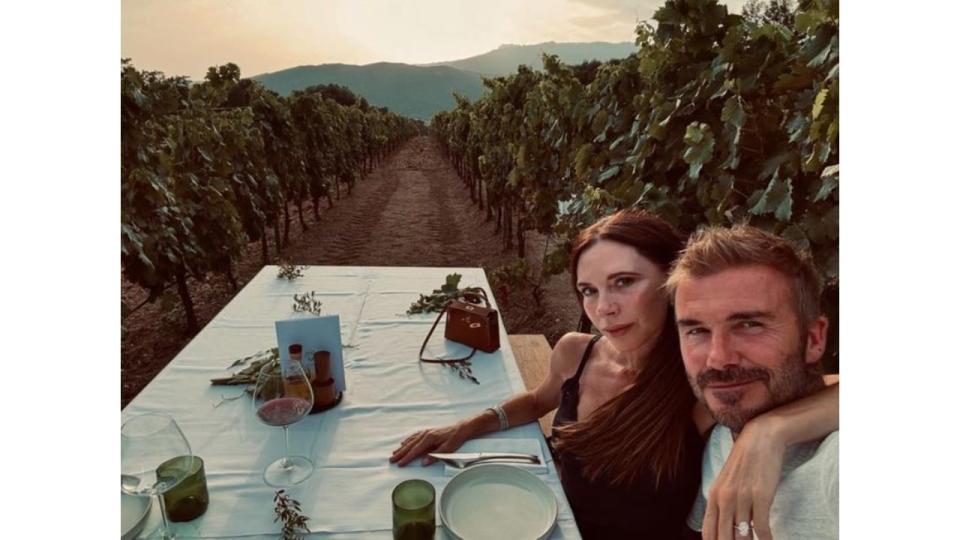 Victoria Beckham and David Beckham dining at a vineyard