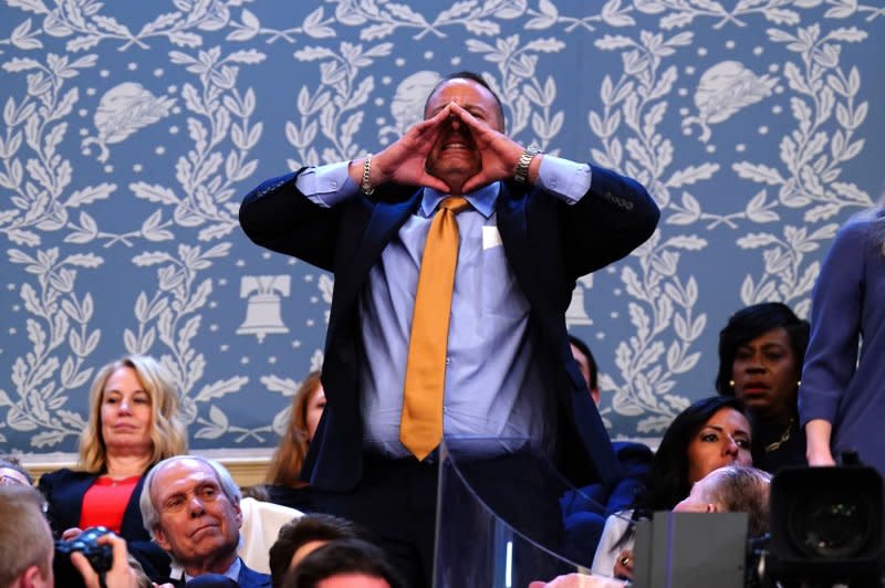 A protester shouts as President Joe Biden delivers the annual State of the Union speech to a joint session of Congress at the U.S. Capitol in Washington on Thursday. Pool Photo by Shawn Thew/UPI