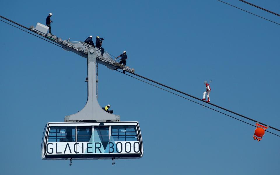 Nock balances blindfold on a cable-car ropeway at Les Diablerets in 2020