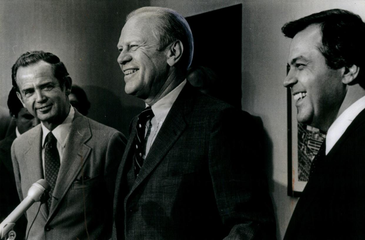 (L-R) Gov. William Milliken, former president Gerald Ford and Vic Caputo speak during a press conference at city airport in 1980.