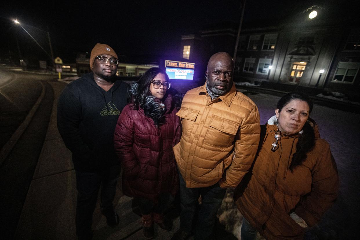 Andre Lyons, his wife, Abigail Santana, Pierre Claude, and his wife, Katherine Martinez are parents of students at the George Fischer Middle School in Carmel. The parents are speaking out after several high school students produced a a series of TikTok videos with racist language and threats of gun violence. They were photographed March 1, 2023 outside Carmel High School before a forum for parents and faculty.