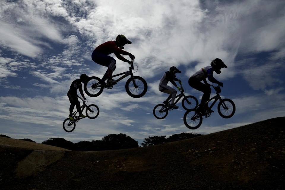 Cyclists compete in the men's cycling BMX heat during the Bolivarian Games in Valledupar, Colombia, Friday, July 1, 2022. (AP Photo/Fernando Vergara)
