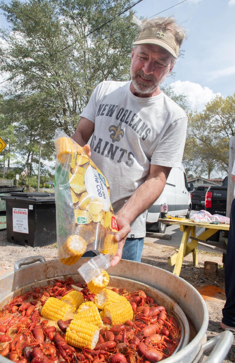 Owner Mike Cosse adds corn to a crawfish boil at Cosse's Corner Shack in Milton on Wednesday, Feb. 28, 2024. The sister establishment Cosse's Place is relocating to the old Chet's Seafood Restaurant on West Navy Boulevard in Pensacola.