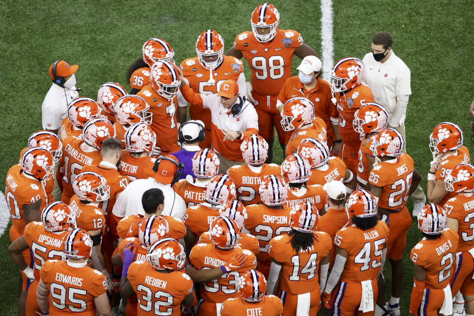 Clemson head coach Dabo Swinney talks with his team during the second half of the Sugar Bowl NCAA college football game against Ohio State Friday, Jan. 1, 2021, in New Orleans. (AP Photo/Butch Dill)