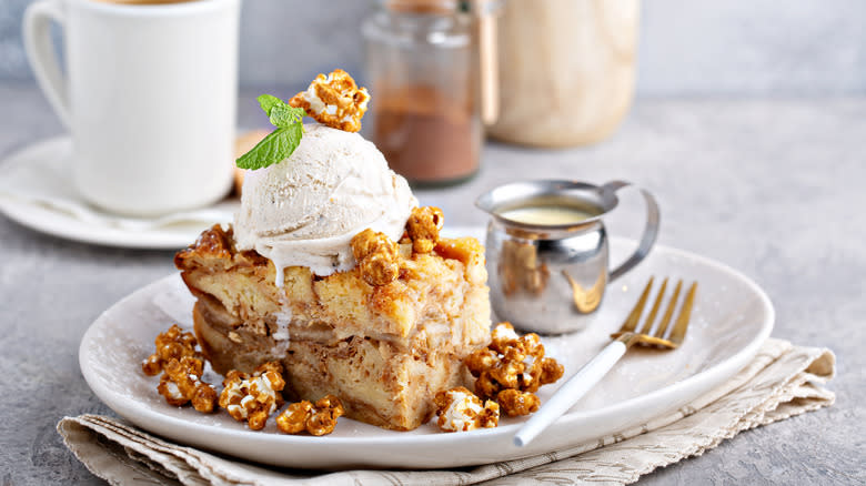 Bread pudding on plate with ice cream on top