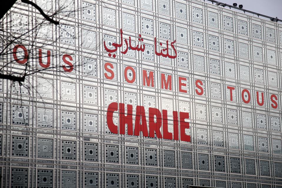 The Arab Institute building bears the message 'We are all Charlie', to pay tribute to the journalists and police who were killed in an Islamist attack January 7, 2015 at the offices of the satirical weekly Charlie Hebdo in Paris January 20, 2015. REUTERS/Charles Platiau (FRANCE - Tags: CRIME LAW RELIGION SOCIETY MEDIA)