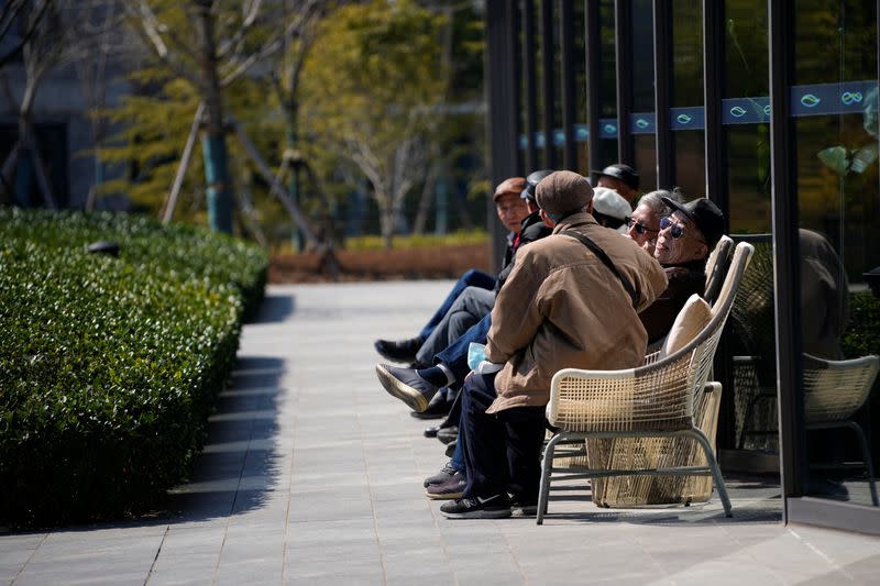 Elderly visitors enjoy the sunshine, at a nursing home of Lendlease's Ardor Gardens in Shanghai