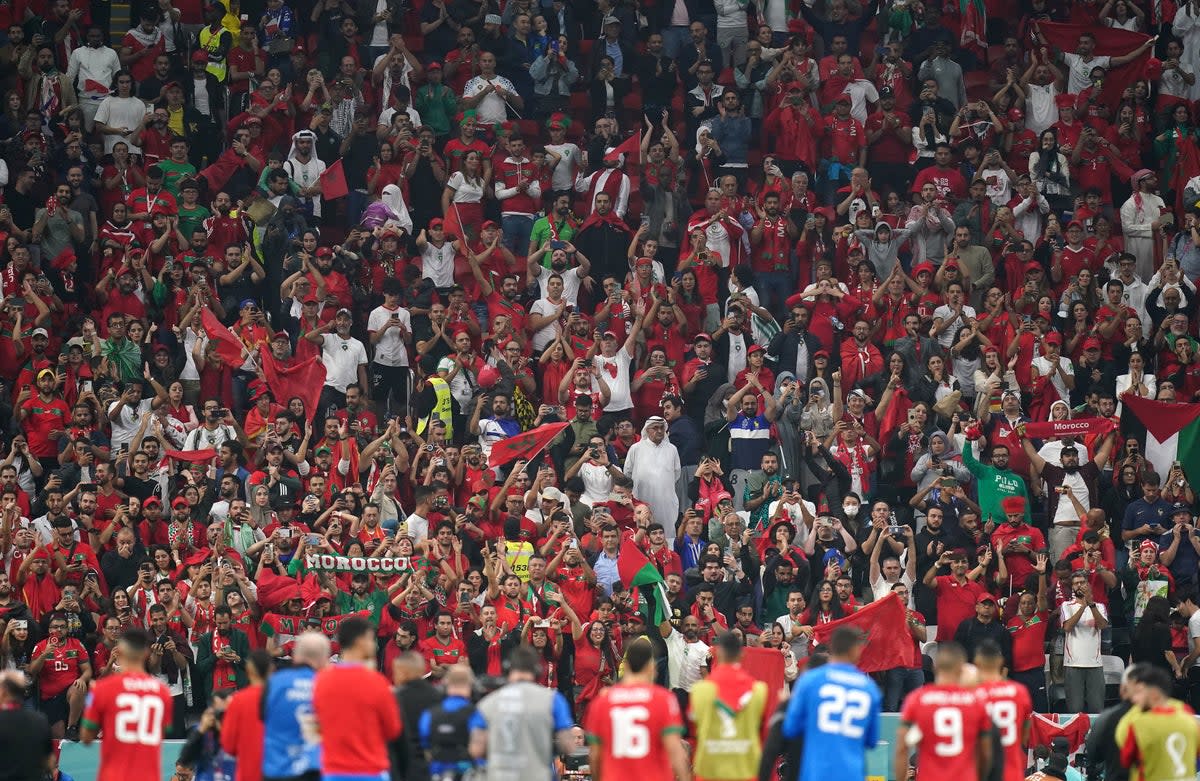 Moroccan fans salute their players after the full-time whistle (PA)