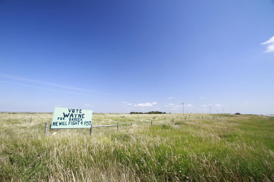 A sign for a tribal council candidate on the Rosebud Indian Reservation is shown on Aug. 6, 2020. An Associated Press analysis in Democratic primaries in South Dakota showed that turnout was 10% lower among voters who lived in counties with a majority American Indian population and at least 95% of the county on reservation land. Voter advocates say that long trips to access polling places and the fact that some people lack reliable transportation has led to low voter turnout. (AP Photo/Stephen Groves)