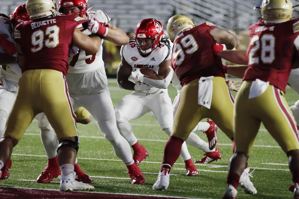 Louisville running back Jalen Mitchell (15) runs for a touchdown during the first half of an NCAA college football game against Boston College, Saturday, Nov. 28, 2020, in Boston. (AP Photo/Michael Dwyer)