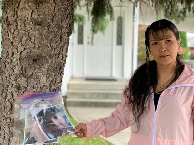 Samantha Chalifoux holds a photo of her son, Traevon Chalifoux-Desjarlais, who died while in the care of Xyolhemeylh, the Fraser Valley Aboriginal Children and Family Services Society. 