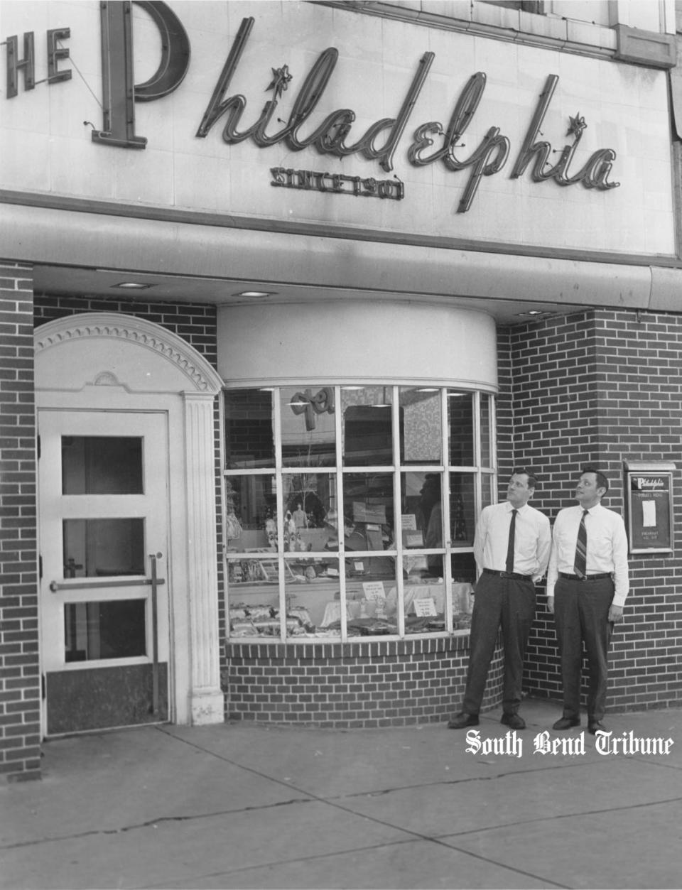 Ted Poledor, left, and his brother, Andrew, stand in front of The Philadelphia, their family's 70-year-old South Bend restaurant, in December 1972. The Philadelphia, 116 N. Michigan St., was preparing to close because the city's downtown revitalization plan had targeted the building for demolition. The Philadelphia restaurant and candy shop opened in about 1902. Tribune photo archives