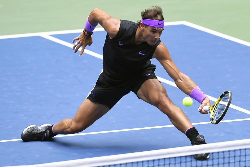 FILE - In this Sept. 8, 2019, file photo, Rafael Nadal, of Spain, returns a shot to Daniil Medvedev, of Russia, during the men's singles final of the U.S. Open tennis championships in New York. Nadal will compete in the Australian Open tennis tournament beginning Monday, Jan. 20, 2020. (AP Photo/Sarah Stier, File)