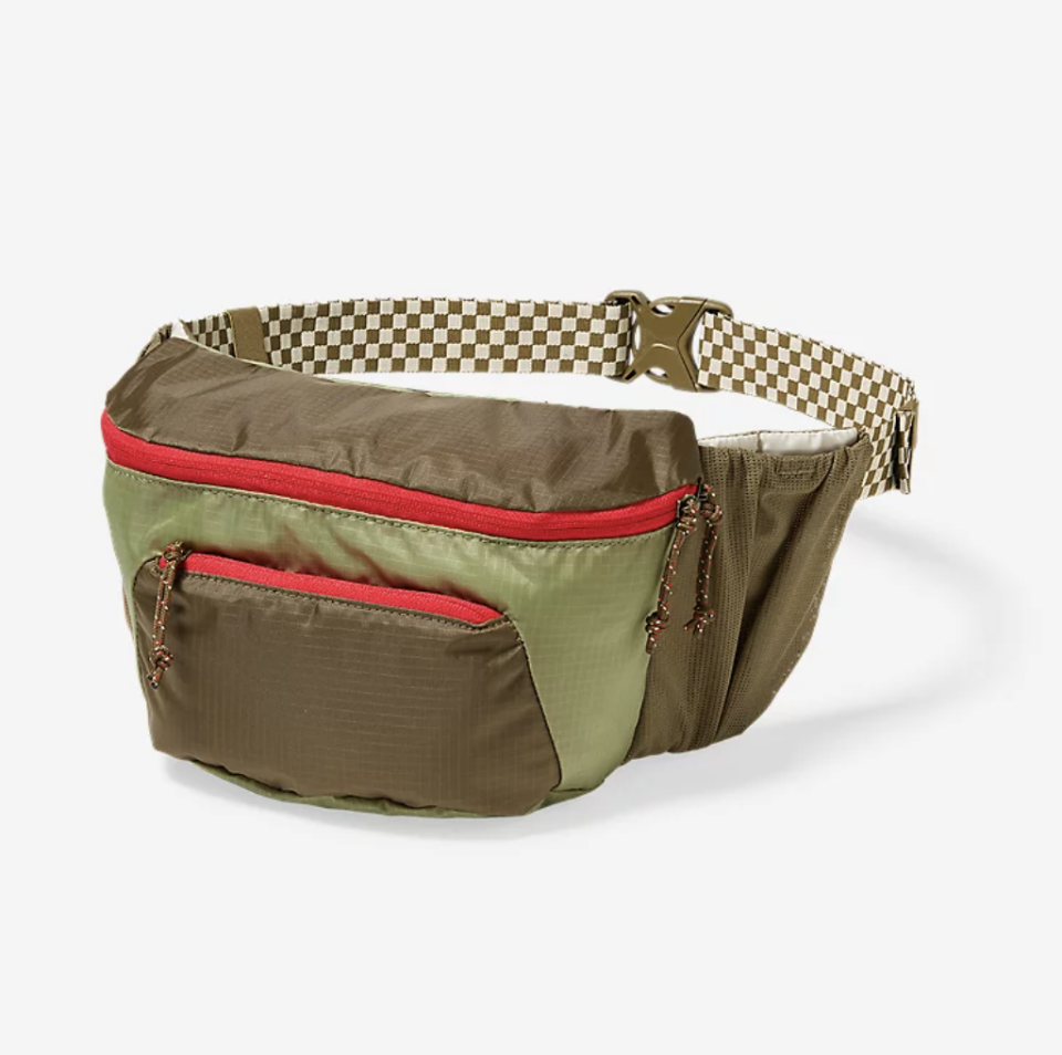 The Great. + Eddie Bauer The Hip Pack in green and red with checks (Photo via Eddie Bauer)