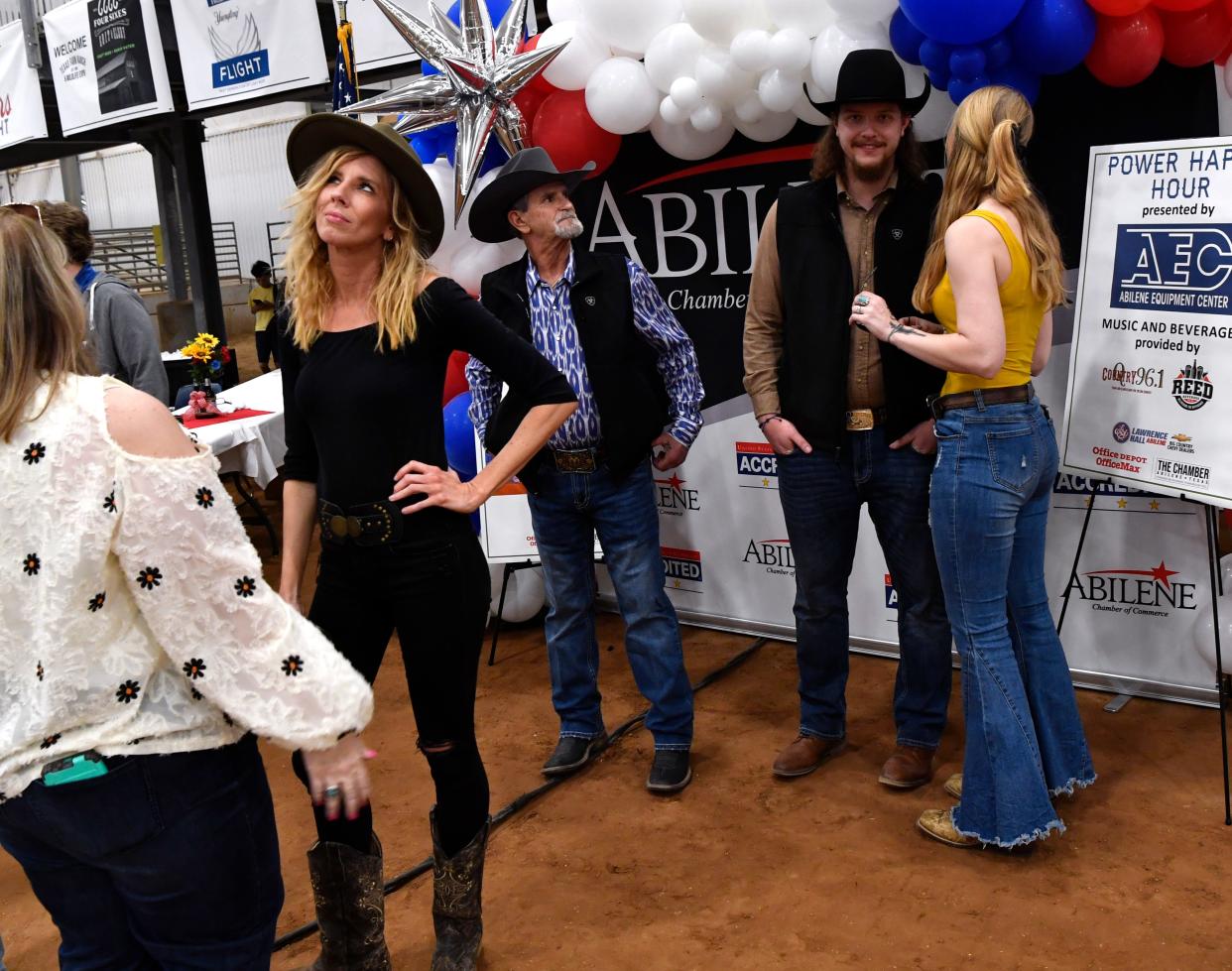 The participants of a Yellowstone lookalike contest, a current TV western, talk with each other during Tuesday's Texas Farm-Ranch-Wildlife Expo in the Taylor Telecom Arena at the Taylor County Expo Center.