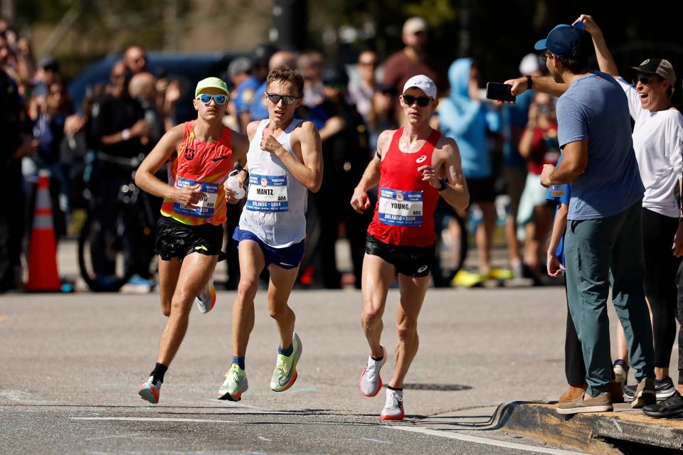 Zachery Panning, Conner Mantz, and Clayton Young run through the course during the 2024 U.S. Olympic Team Trials - Marathon on Feb. 3 in Orlando.