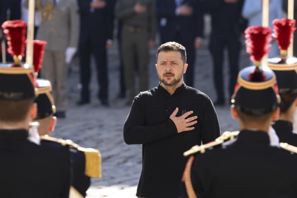 Ukrainian President Volodymyr Zelenskyy attends a military honor ceremony, Friday, June 7, 2024 at the Invalides monument in Paris. U.S. President Joe Biden was due to meet with Ukrainian President Volodymyr Zelenskyy in Paris on Friday as Kyiv's army endures its hardest days of fighting since the early weeks of the war with Russia and prepares for what officials say could be a tough summer ahead. (AP Photo/Sophie Garcia)