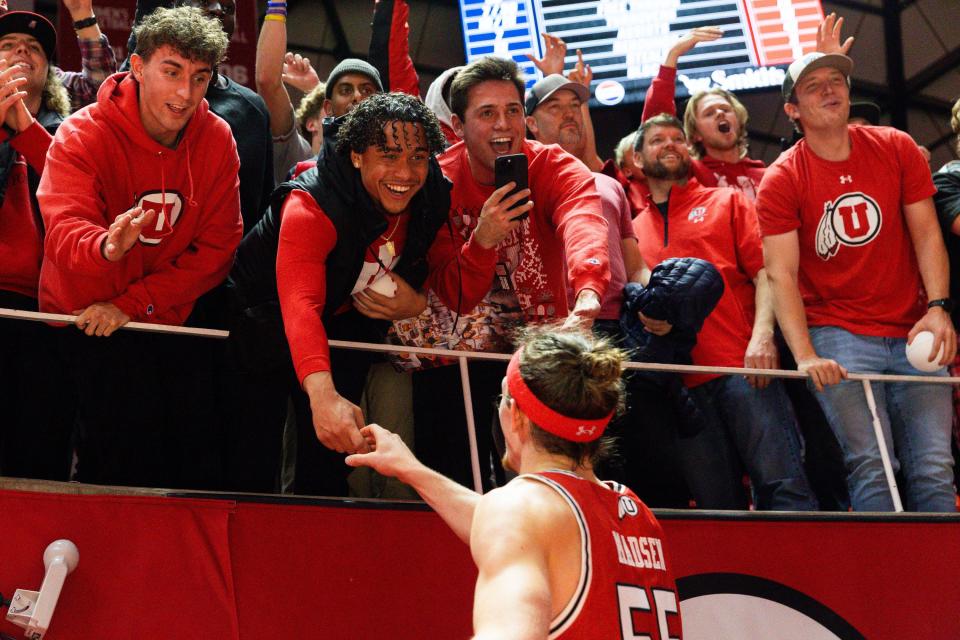 Utah Utes guard Gabe Madsen (55) greets University of Utah fans after their victory over rival Brigham Young University during a men’s basketball game at the Jon M. Huntsman Center in Salt Lake City on Saturday, Dec. 9, 2023. | Megan Nielsen, Deseret News