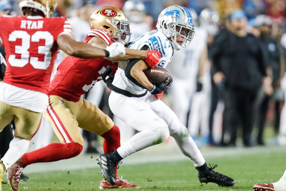 Lions wide receiver Amon-Ra St. Brown makes a catch against 49ers cornerback Charvarius Ward during the second half of the Lions' 34-31 loss in the NFC championship game in Santa Clara, California, on Sunday, Jan. 28, 2024.