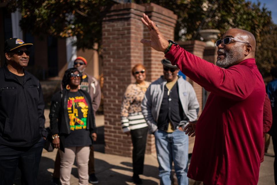 Fred Whitley Jr. speaks to tourgoers during a stop at Fisk University in Nashville. Whitley leads a bus tour that focuses on Black history in Nashville.