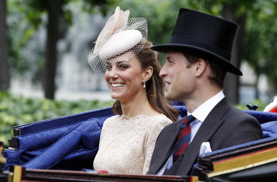 Britain's Prince William and his wife Kate, Duchess of Cambridge take an open top carriage ride through the streets of London after a Diamond Jubilee Luncheon given for The Queen, Tuesday June 5, 2012 . Crowds cheering "God save the queen!" and pealing church bells greeted Queen Elizabeth II on Tuesday as she arrived for a service at St. Paul's Cathedral on the last of four days of celebrations of her 60 years on the throne. (AP Photo/Peter Byrne/Pool)