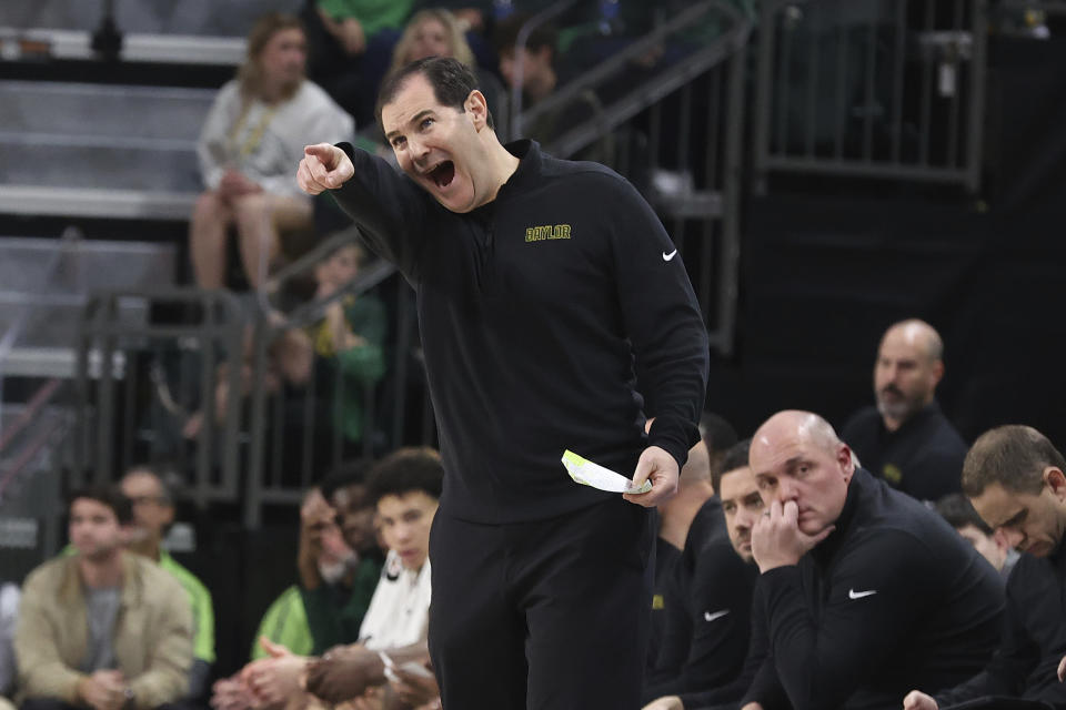 Baylor head coach Scott Drew calls out a plays to his team during the first half of an NCAA college basketball game against Texas Tech Tuesday, Feb. 6, 2024, in Waco, Texas. (AP Photo/Jerry Larson)