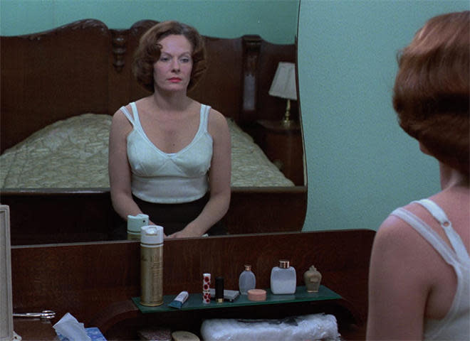 Delphine Seyrig as a woman whose daily routine includes work as a prostitute in Chantal Akerman's 