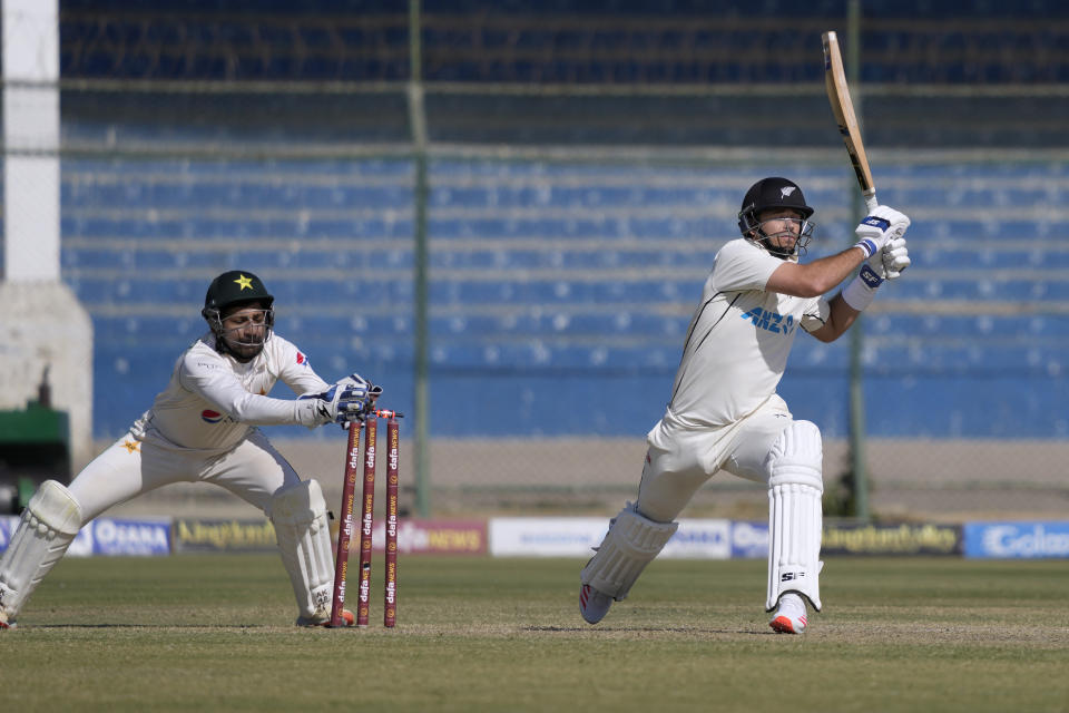 Pakistan's Sarfraz Ahmed, left, attempts stump out to New Zealand's Tim Southee during the second day of the second test cricket match between Pakistan and New Zealand, in Karachi, Pakistan, Tuesday, Jan. 3, 2023. (AP Photo/Fareed Khan)