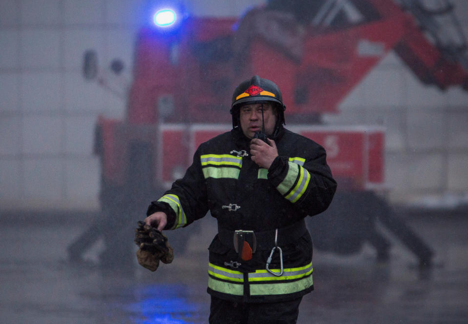 <p>A member of the Emergency Situations Ministry works at the scene of a fire in a shopping mall in the Siberian city of Kemerovo, Russia, March 25, 2018. (Photo: Maksim Lisov/Reuters) </p>