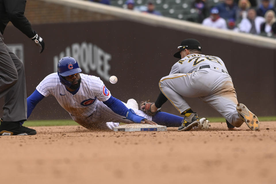 Chicago Cubs' Jason Heyward, left, slides safely past Pittsburgh Pirates second baseman Adam Frazier (26) during the seventh inning of a baseball game, Saturday, May 8, 2021, in Chicago. (AP Photo/Matt Marton)