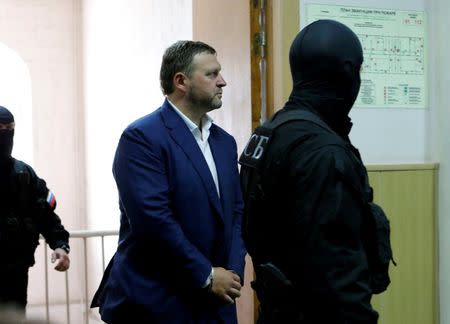 Governor of Kirov region Nikita Belykh, who is accused by the Investigative Committee of taking a bribe, is escorted by Federal Security Service (FSB) officers upon his arrival to a hearing at the Basmanny district court in Moscow, Russia, June 25, 2016. REUTERS/Maxim Zmeyev